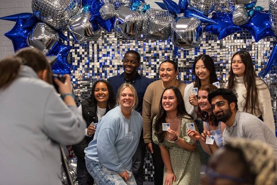 A group of students posing with their awards at the Student Life Awards ceremony